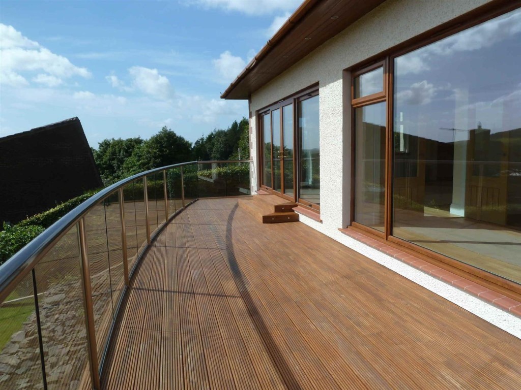 curved glass balustrade with handrail