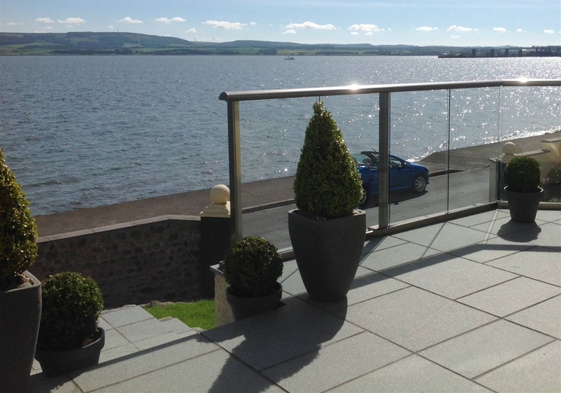 Royal Chrome Glass Balcony overlooking lake in Scotland